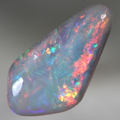 SOLID SEMI BLACK OPAL Bright reds roll over green and blue. SEE VIDEO